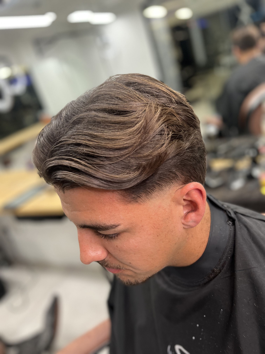 subtle studio mens barbers middle part and undercut hairstyle